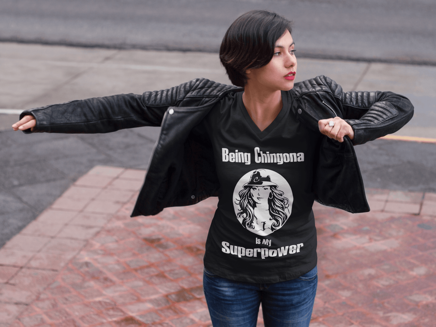 Ladies Black V-neck t-shirt with white lettering of "Being Chingona Is My Superpower" 
