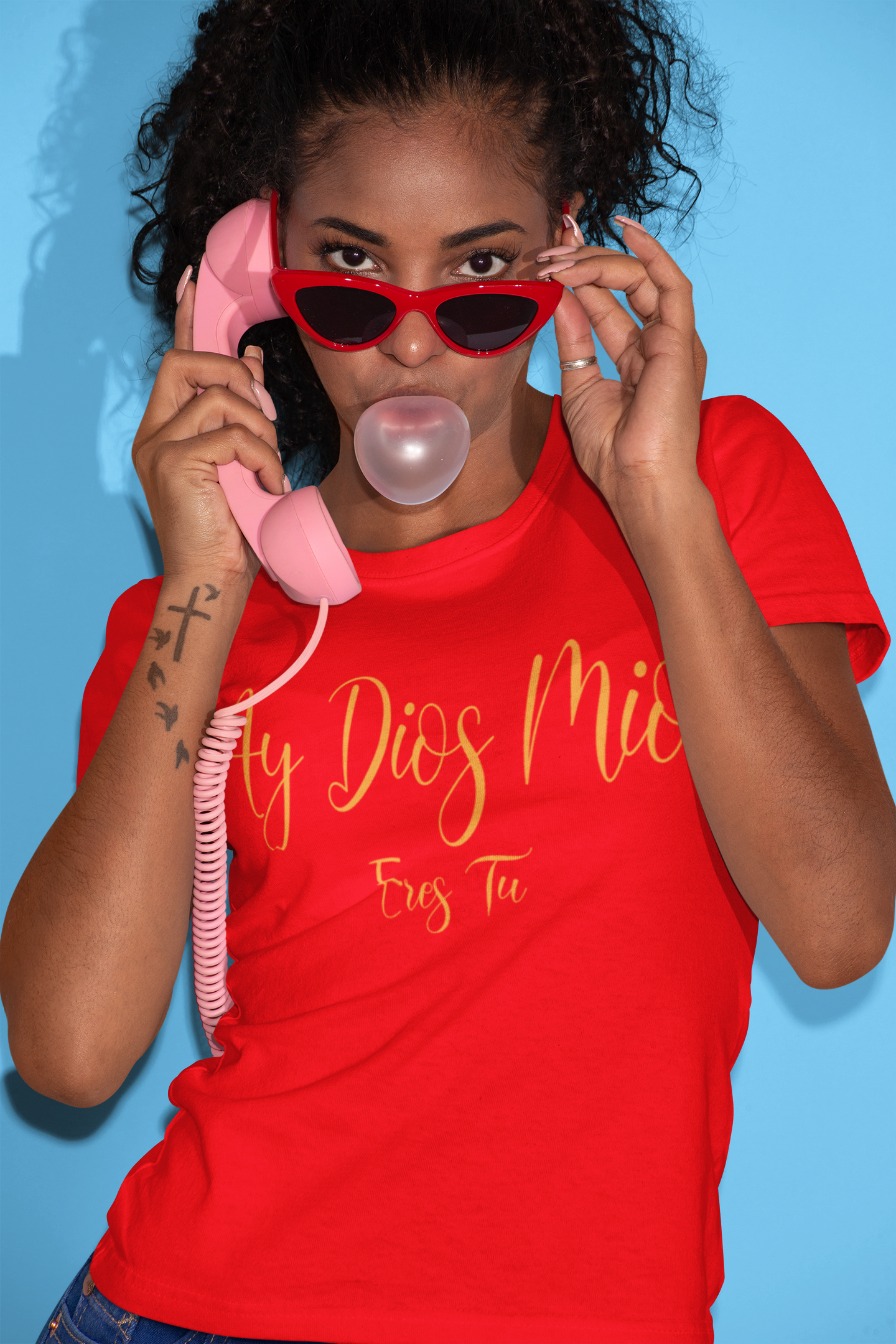 Ladies cut red tee with the text "Ay Dios Mio, Eres Tu" in gold yellow text written on it.
