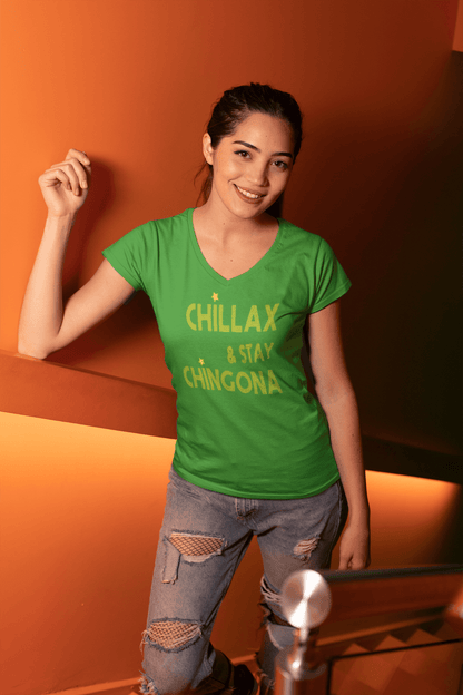 Green V-neck t-shirt with the text, "Chillax Y Stay Chingona" in streetwear font and yellow ink. This sexy tee comes in sizes small thru 3XL. It is available at www.sanchezhere.com