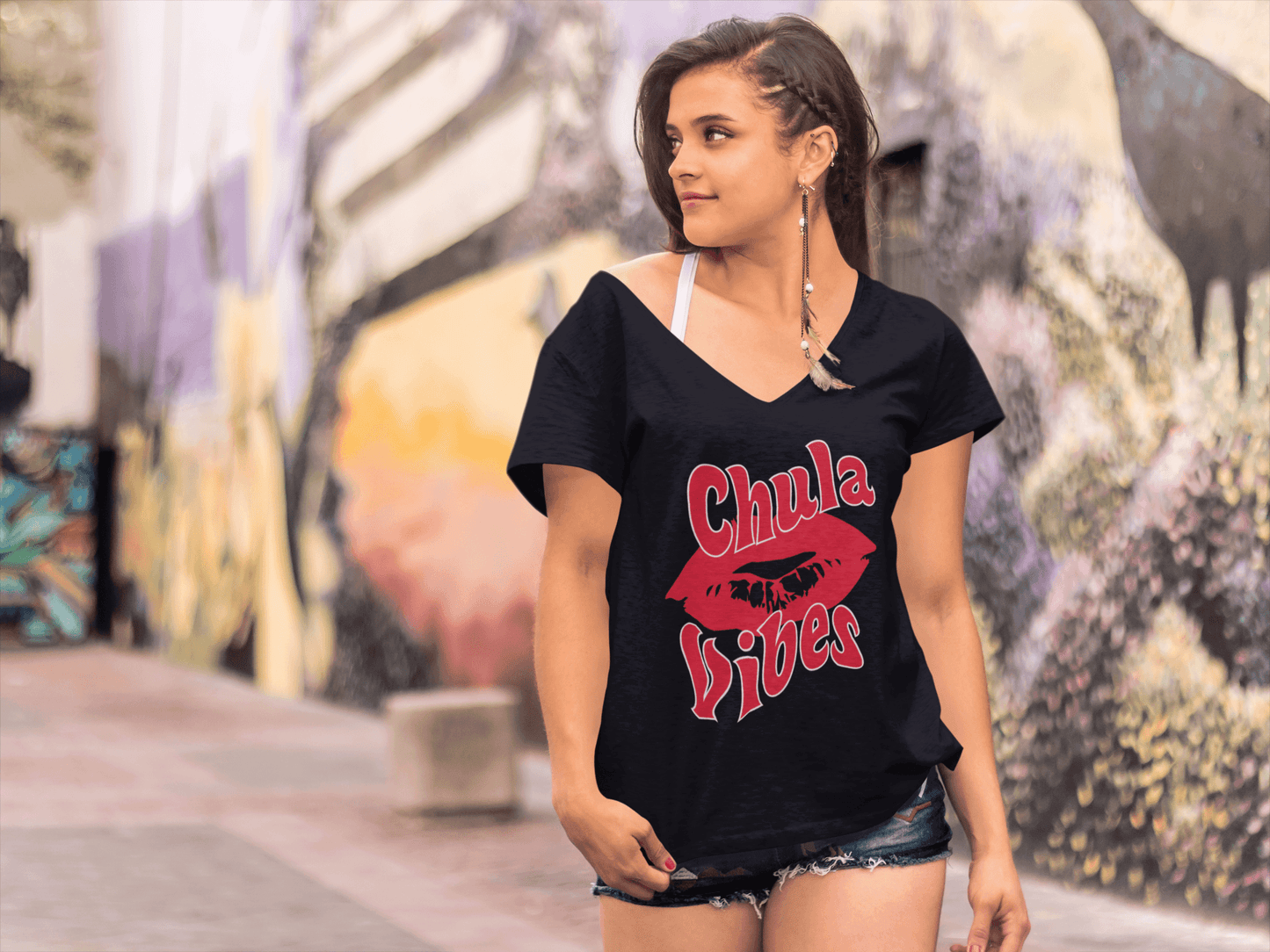 Black V-neck t-shirt with the text, "Chula Vibes" in red ink and an image of lips. This cute tee comes in sizes small thru 3XL. It is available at www.sanchezhere.com