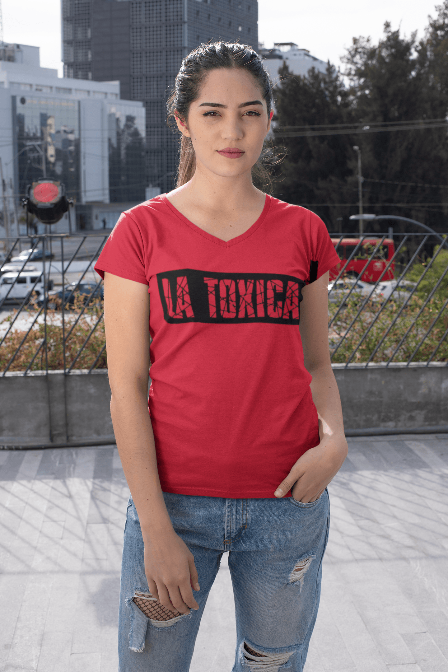 Red V-Neck Women's T-shirt with the text "La Toxica" in black ink and in a very stylish streatwear design. This t-shirt comes in sizes sm-3xl and is available at www.sanchezhere.com