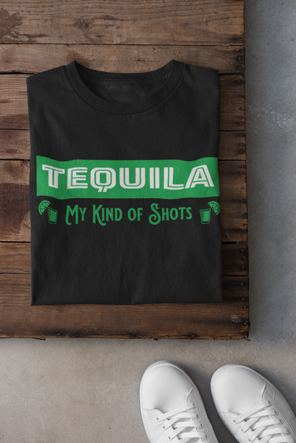 Black Unisex T-shirt with the text, Tequila My Kind of shots, and a picture of two shot glasses in lime green ink. This tee comes in sizes small-3xl and is available at www.sanchezhere.com