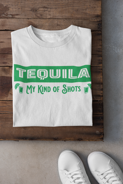 White Unisex T-shirt with the text, Tequila My Kind of shots, and a picture of two shot glasses in lime green ink. This tee comes in sizes small-3xl and is available at www.sanchezhere.com